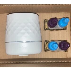 Febreze Plug Scent Booster Starter Kit, Plug In Diffuser + 2 Downy Calm Refills